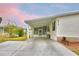 Charming single-story home with a spacious carport and well-maintained landscaping at 6510 Oak Hammock Ln, Winter Haven, FL 33884