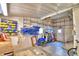 Well-organized garage featuring shelving, a workbench, and storage, perfect for hobbies at 6510 Oak Hammock Ln, Winter Haven, FL 33884