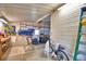 Clean garage interior with shelving, a work area, and side door access, ideal for projects at 6510 Oak Hammock Ln, Winter Haven, FL 33884