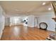 Open-concept living area with hardwood floors, leading into kitchen space at 6510 Oak Hammock Ln, Winter Haven, FL 33884