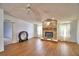 Cozy living room with a brick fireplace, ceiling fan, and neutral-toned walls at 6510 Oak Hammock Ln, Winter Haven, FL 33884