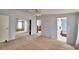 Spacious bedroom with carpeting, mirrored closet doors, ceiling fan and ensuite bathroom at 6510 Oak Hammock Ln, Winter Haven, FL 33884