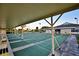 Outdoor shuffleboard courts surrounded by mature trees and benches for comfortable viewing at 6510 Oak Hammock Ln, Winter Haven, FL 33884