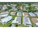 Aerial view of neighborhood showcasing home's location with mature trees at 6603 Scenic Point Se Dr, Winter Haven, FL 33884