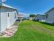 View of well-maintained green lawns and the exteriors of adjacent homes in the community at 6603 Scenic Point Se Dr, Winter Haven, FL 33884