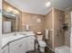 A full bathroom with a single sink vanity, walk-in shower, and updated fixtures, creating a functional space at 6603 Scenic Point Se Dr, Winter Haven, FL 33884