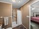 A well-lit bathroom features a walk-in shower with handrails, complemented by the neutral color scheme at 6603 Scenic Point Se Dr, Winter Haven, FL 33884