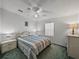 Comfortable bedroom featuring a ceiling fan, window blinds, and a serene ambiance for restful nights at 6603 Scenic Point Se Dr, Winter Haven, FL 33884