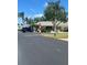 Exterior view of the clubhouse with lush landscaping and ample parking at 6603 Scenic Point Se Dr, Winter Haven, FL 33884