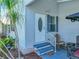 Inviting front entrance with a white door and a small garden area at 6603 Scenic Point Se Dr, Winter Haven, FL 33884