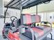 Close up of a golf cart, highlighting comfortable seating and the vehicle's design features at 6603 Scenic Point Se Dr, Winter Haven, FL 33884