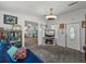 Open concept living area with comfortable seating and an adjacent entertainment center at 6603 Scenic Point Se Dr, Winter Haven, FL 33884
