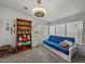 Comfortable living room with natural light, soft seating, and a decorative shelf at 6603 Scenic Point Se Dr, Winter Haven, FL 33884