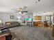 Open-concept living room combining the living area, kitchen, and dining space at 6603 Scenic Point Se Dr, Winter Haven, FL 33884
