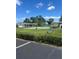 Community tennis courts surrounded by landscaping on a beautiful, sunny day at 6603 Scenic Point Se Dr, Winter Haven, FL 33884