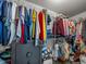 Organized walk-in closet featuring wire shelving and plentiful storage space for clothes and accessories at 6603 Scenic Point Se Dr, Winter Haven, FL 33884