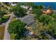 Aerial view of the property with mature trees, screened pool, and RV/Boat parking at 6754 Winterset Gardens Rd, Winter Haven, FL 33884