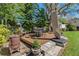 Backyard deck with outdoor seating and a grill, perfect for entertaining at 6754 Winterset Gardens Rd, Winter Haven, FL 33884