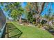 Spacious backyard featuring a patio with outdoor furniture and lush landscaping at 6754 Winterset Gardens Rd, Winter Haven, FL 33884