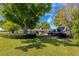 Large backyard with mature trees providing ample shade and privacy at 6754 Winterset Gardens Rd, Winter Haven, FL 33884