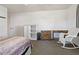 Bedroom featuring neutral walls and carpet flooring, providing a comfortable and peaceful retreat at 6754 Winterset Gardens Rd, Winter Haven, FL 33884