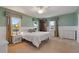 Relaxing bedroom boasting multiple windows, nice carpet, and a wardrobe at 6754 Winterset Gardens Rd, Winter Haven, FL 33884