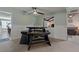 Casual dining area with a modern table and chairs set and views to other rooms at 6754 Winterset Gardens Rd, Winter Haven, FL 33884