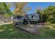RV and Boat Parking in driveway on lot surrounded by mature trees and grass at 6754 Winterset Gardens Rd, Winter Haven, FL 33884