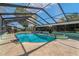 Relaxing pool area featuring a pool, a hot tub, and lounge furniture at 6754 Winterset Gardens Rd, Winter Haven, FL 33884