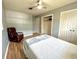 This bedroom includes neutral walls, warm floors, a fan, and closet space at 799 W Lake Otis Dr, Winter Haven, FL 33880