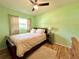 Comfortable bedroom with bright, natural light and a soft, inviting aesthetic at 799 W Lake Otis Dr, Winter Haven, FL 33880