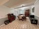 Open dining area with tiled floor, complemented by wooden furniture and natural light at 799 W Lake Otis Dr, Winter Haven, FL 33880