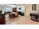 Dining room with a traditional table setting, decorative furnishings, and tiled flooring at 799 W Lake Otis Dr, Winter Haven, FL 33880