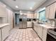Bright kitchen features stainless steel appliances, tile backsplash, and ample cabinet space at 799 W Lake Otis Dr, Winter Haven, FL 33880