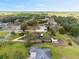 Picturesque aerial view of the property highlighting its large, well-maintained lawn and surrounding natural landscape at 8947 Oakwood Dr, Lake Wales, FL 33898
