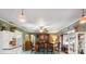 View of the dining room with wood table, black chairs, and traditional furnishings at 8947 Oakwood Dr, Lake Wales, FL 33898