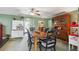Traditional dining room featuring a wood table, black chairs, and a built-in china cabinet at 8947 Oakwood Dr, Lake Wales, FL 33898