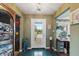 Charming entryway with tile flooring, a view of the front yard, and quaint decor at 8947 Oakwood Dr, Lake Wales, FL 33898