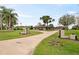 Well-maintained ranch-style home with mature landscaping and a charming front yard at 8947 Oakwood Dr, Lake Wales, FL 33898