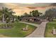 Charming ranch-style home featuring a spacious driveway, well-manicured lawn, and mature landscaping including palm trees at 8947 Oakwood Dr, Lake Wales, FL 33898