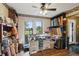Bright hobby room features wood floors, natural light and ample storage for creative projects at 8947 Oakwood Dr, Lake Wales, FL 33898