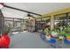 Enclosed lanai with ceiling fan, neutral carpet and views of the surrounding yard and neighborhood at 8947 Oakwood Dr, Lake Wales, FL 33898