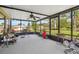 Screened-in lanai providing an airy view of the backyard landscaping at 8947 Oakwood Dr, Lake Wales, FL 33898