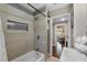 Beautiful bathroom featuring modern tile, new fixtures, and a shower-tub combo at 903 S Lakeview Ave, Bartow, FL 33830