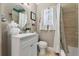 Bright bathroom featuring a vanity, toilet, and a shower with curtain at 903 S Lakeview Ave, Bartow, FL 33830
