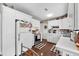 Bright kitchen features all white cabinets and countertops, and dark floors creating a clean and inviting culinary space at 903 S Lakeview Ave, Bartow, FL 33830