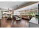 Inviting open-concept living room and kitchen with wood floors, ample natural light, and seamless flow for entertaining at 903 S Lakeview Ave, Bartow, FL 33830
