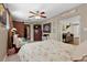 Comfortable main bedroom with ceiling fan, barn door closet, and access to living room at 903 S Lakeview Ave, Bartow, FL 33830