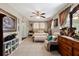 Cozy primary bedroom featuring a ceiling fan, closet, dresser, and tile flooring at 903 S Lakeview Ave, Bartow, FL 33830