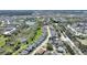 High angle aerial shot showing pond, homes, and local roads at 916 Balmoral Dr, Davenport, FL 33896